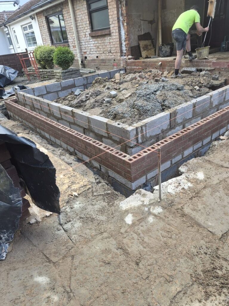 Groundworks and foundation trenches dug for a house extension