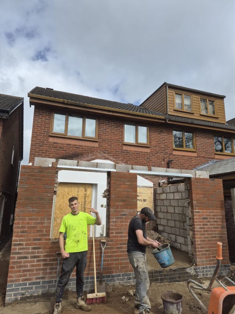 J&L Construction bricklayers working on site on a house extension
